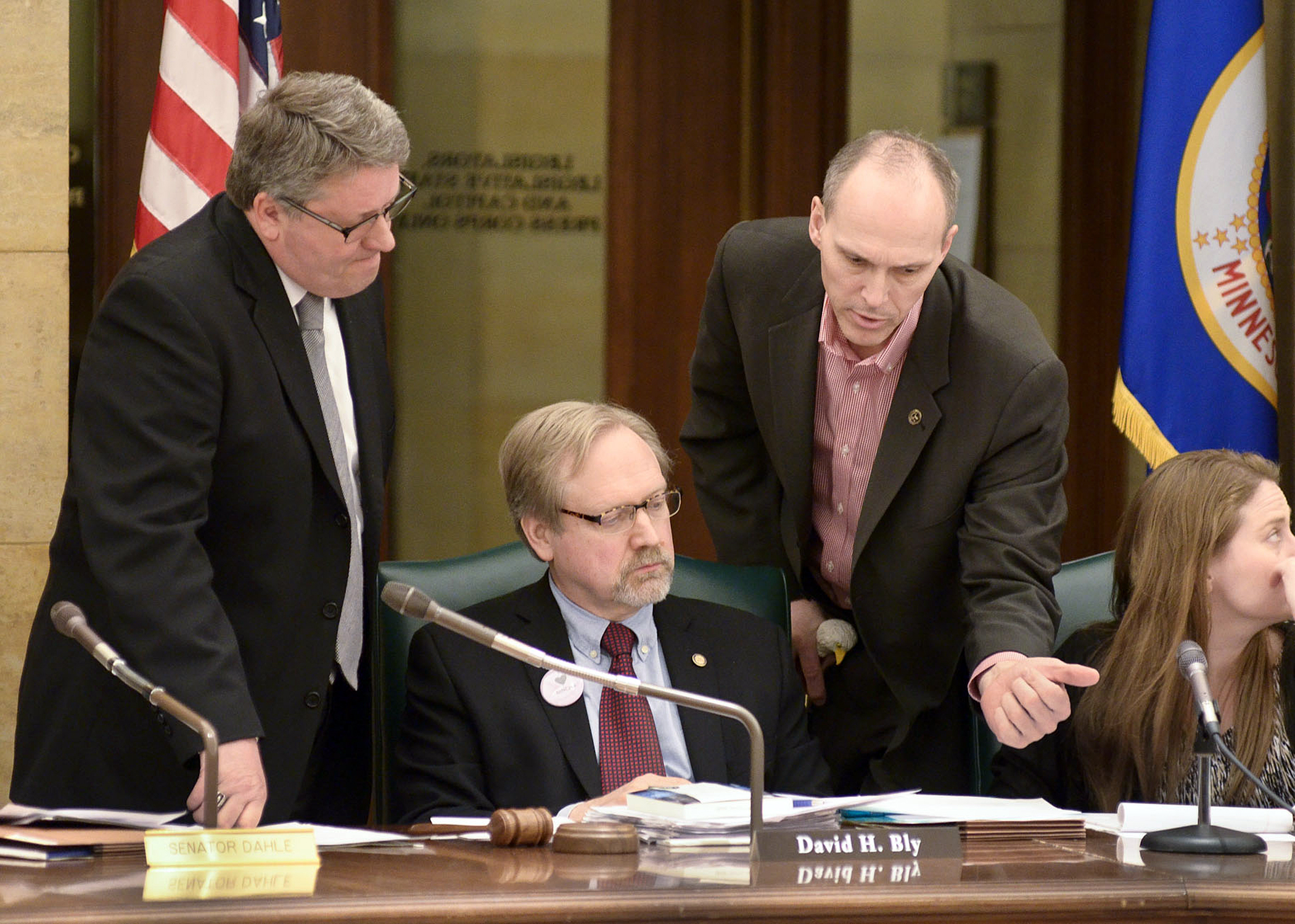 Sen. Kevin Dahle, left, and Rep. Rod Hamilton, right, confer with Conference Committee Chair Rep. David Bly, when an agreement was reached Tuesday on a bill that would provide $893,000 for Minnesota’s emergency response to the avian influenza outbreak. Photo by Andrew VonBank